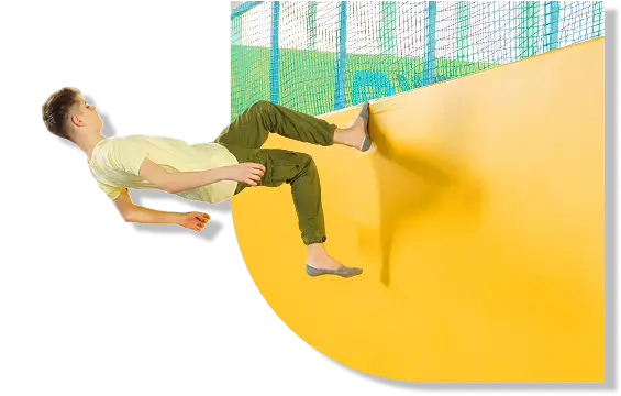 Boy walking on trampoline wall at Flyout Trampoline Park