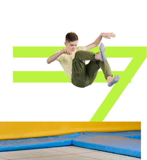 Boy flipping on trampoline at Flyout Trampoline Park